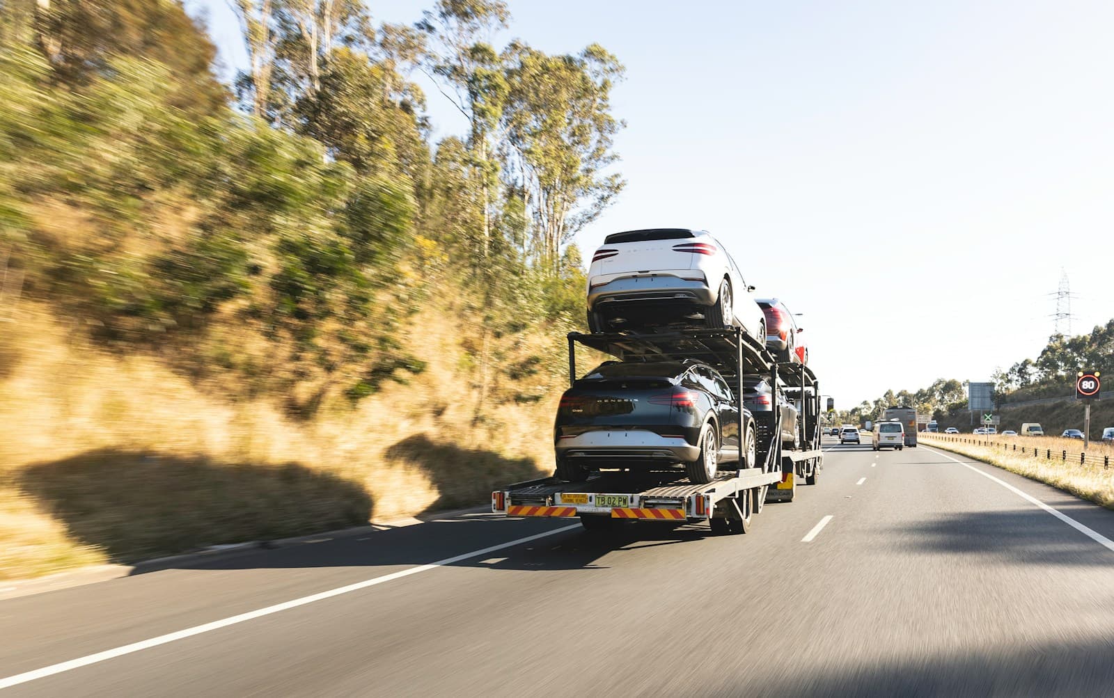 A car carrier loaded with vehicles travelling along the highway