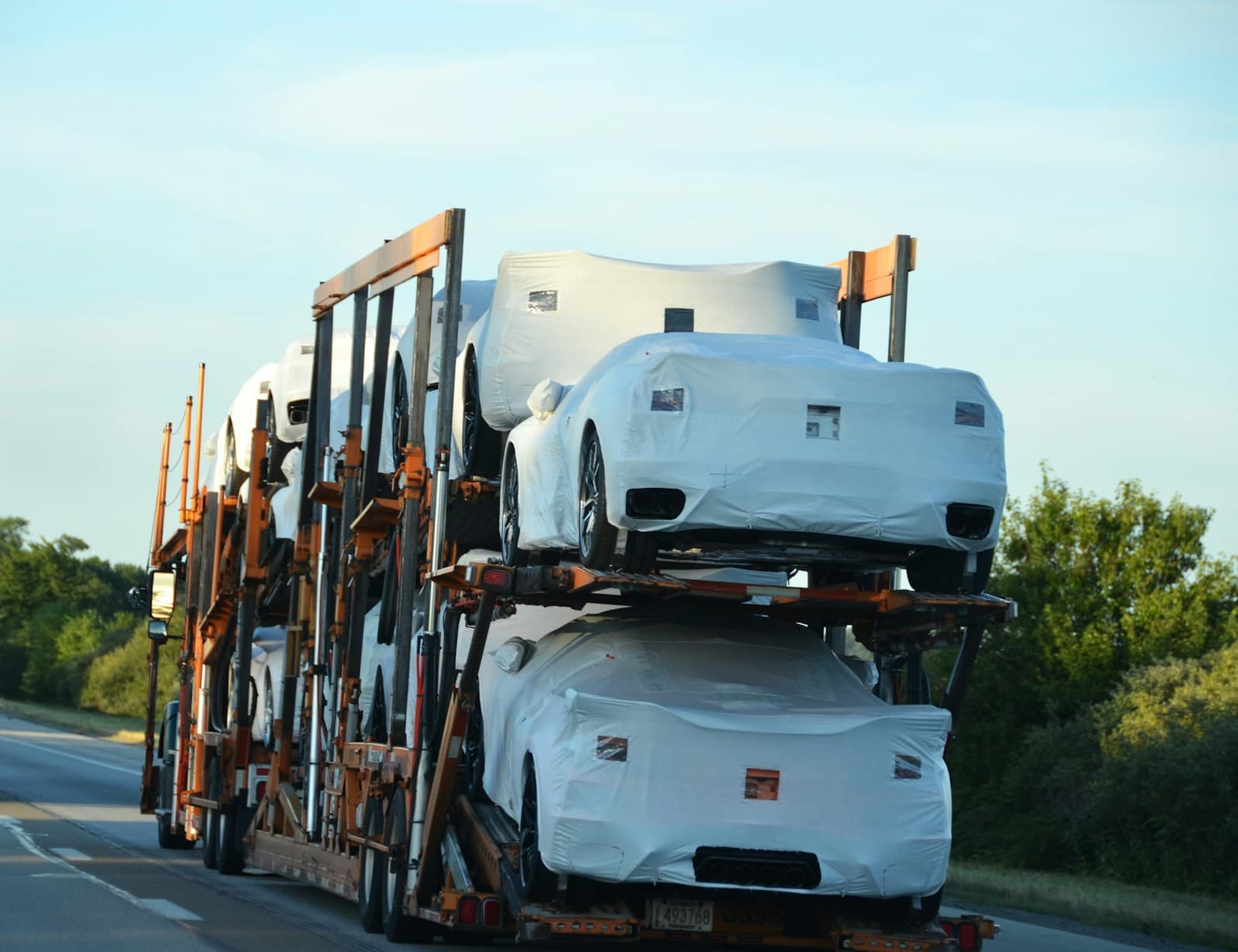 A loaded car carrier travelling along the highway