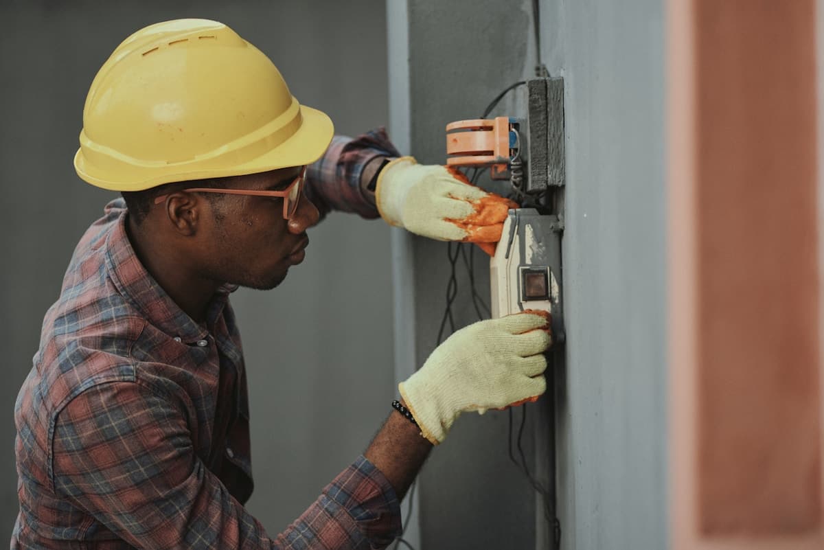A field technician working on-site, away from a desk